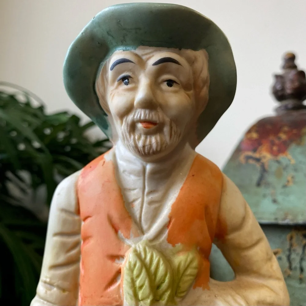Vintage Ceramic Farmer Figurine in Green and Orange